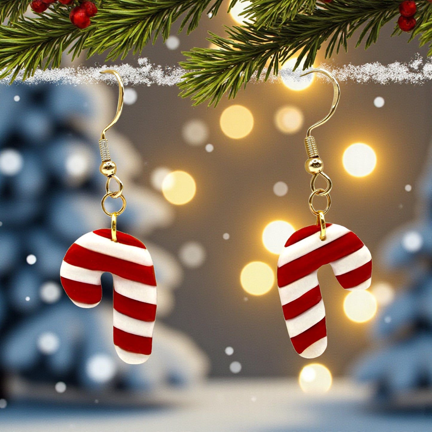 Christmas Candy Cane earrings of red and white with a festive background of lights and tree branches.