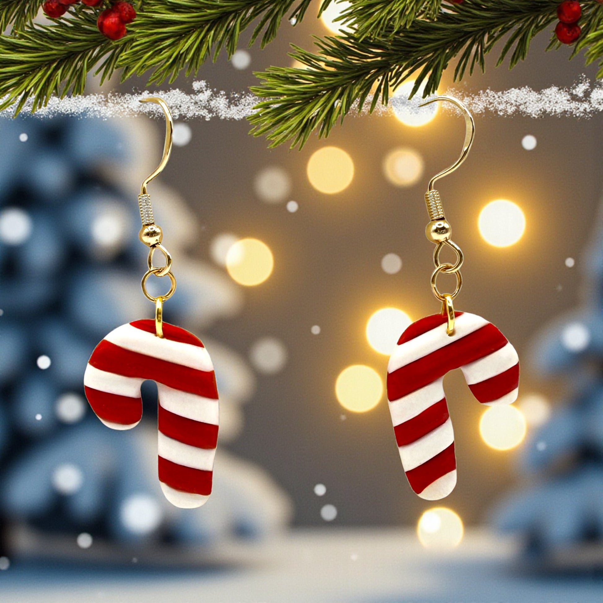 Christmas Candy Cane earrings of red and white with a festive background of lights and tree branches.