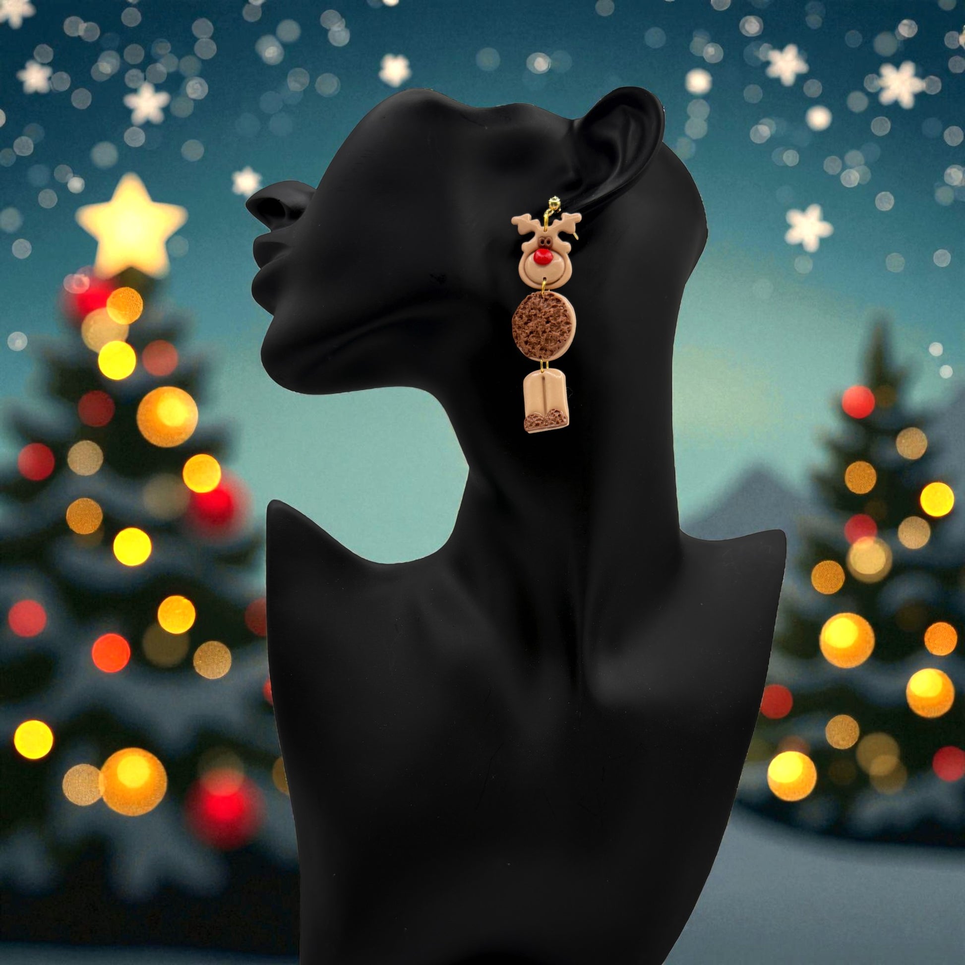 Christmas Reindeer earring on a black mannequin with Christmas tree lights in the background