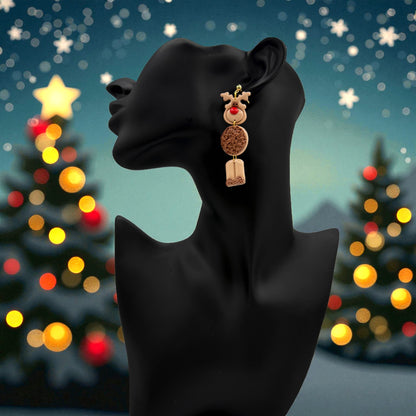 Christmas Reindeer earring on a black mannequin with Christmas tree lights in the background