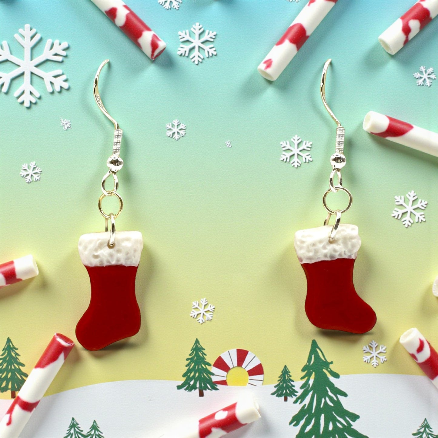 Christmas Stocking earrings in red and white with  a festive background.
