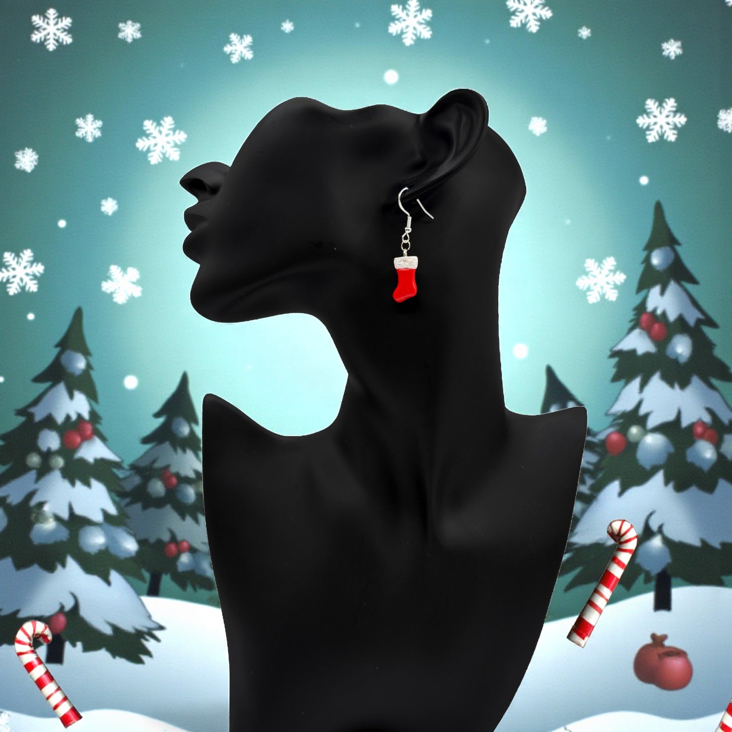 A black mannequin head with Christmas Stocking earrings in red and white against a festive background with trees and snowflakes.