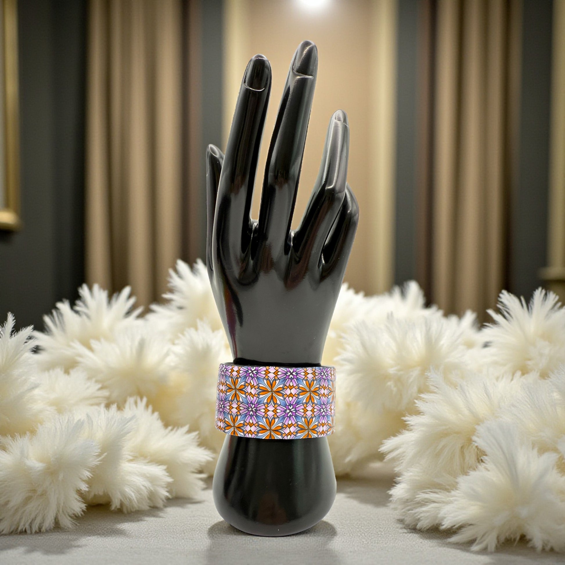 These Pretty Things Floral Geometric Cuff with a 1920's themed background including a beige feather boa.