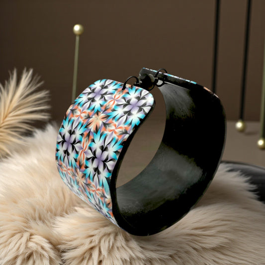 These Pretty Things Kaleidoscope Multicoloured Cuff with a 1920's inspired background using a cream feather boa.